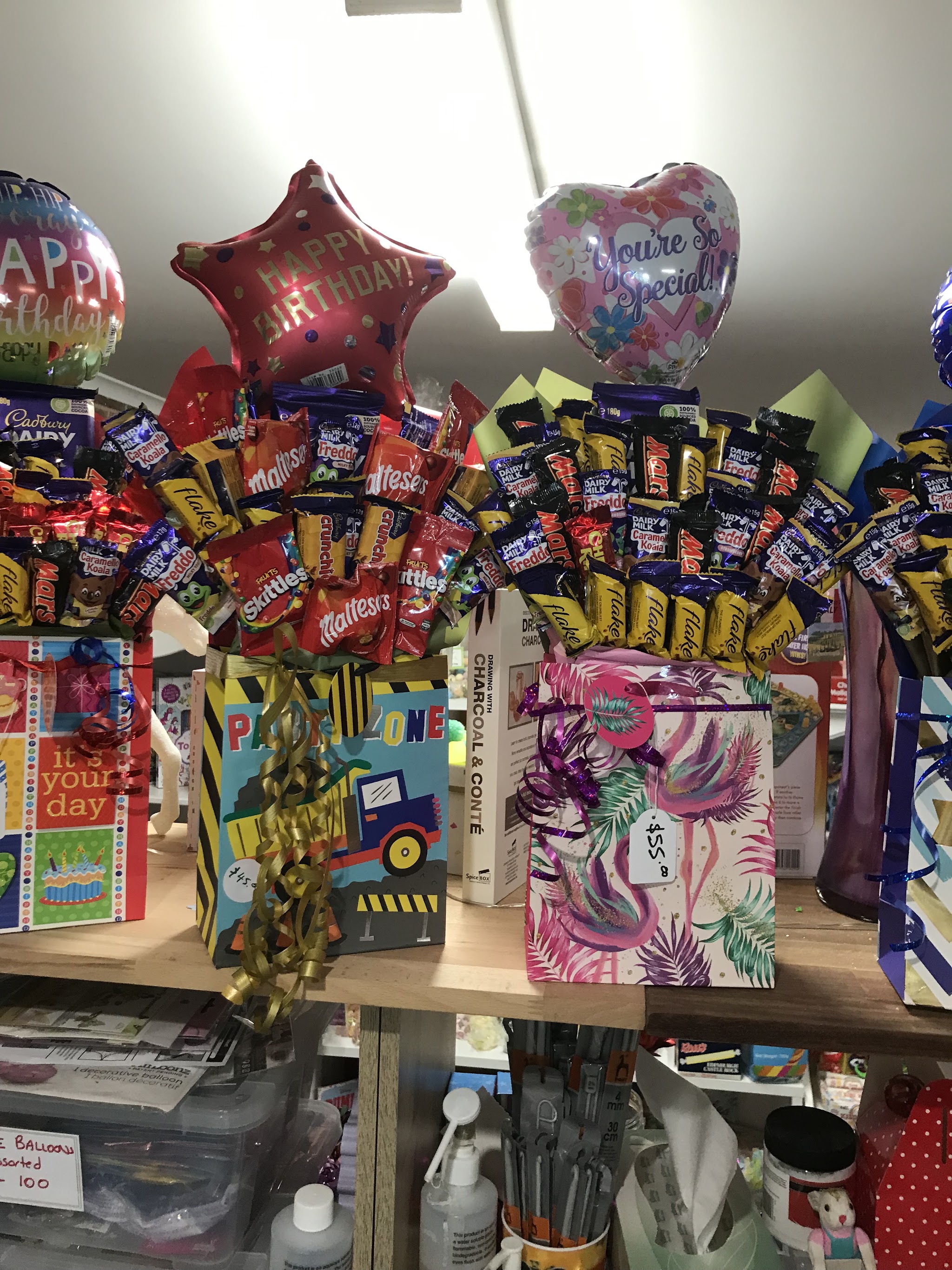 Two lolly bouquets with Happy Birthday and You’re So Special balloons